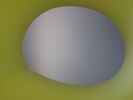 Keltavihreää taustaa vasten harmaansävyinen epätäydellisen muotoinen ympyrä.